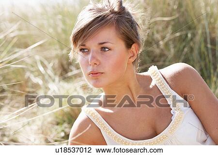 Portrait Of Beautiful Young Woman Relaxing On Beach View Large Photo Image Stock Image - Portrait Of Beautiful Young Woman Relaxing On Beach. Fotosearch