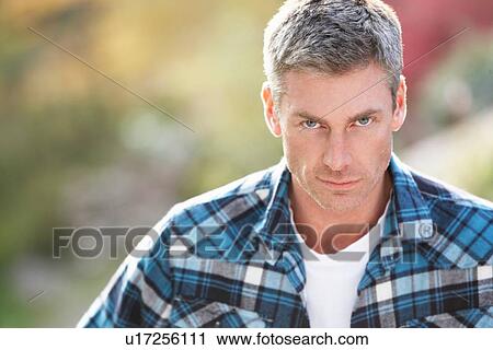 Portrait Of Man Standing Outside In Autumn Landscape View Large Photo Image Stock Image - Portrait Of Man Standing Outside In Autumn Landscape. Fotosearch