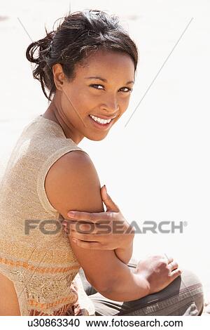 Portrait Of Pretty Teenage Girl Sitting On Beach View Large Photo Image Stock Image - Portrait Of Pretty Teenage Girl Sitting On Beach. Fotosearch