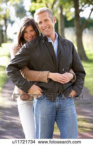 Picture - Portrait Of Romantic Couple Enjoying Outdoor Walk Through Autumn Park. Fotosearch