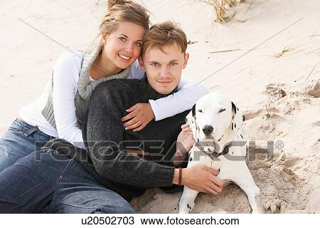 Portrait Of Romantic Teenage Couple On Beach With Dog View Large Photo Image Stock Image - Portrait Of Romantic Teenage Couple On Beach With Dog. Fotosearch