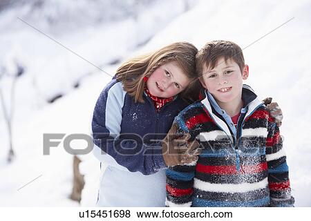 Portrait Of Two Children In Snowy Landscape View Large Photo Image Stock Photo - Portrait Of Two Children In Snowy Landscape. Fotosearch