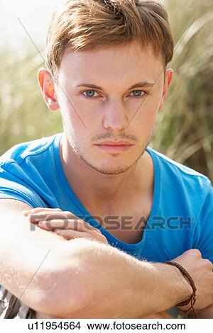 Picture - Portrait Of Young Man On Beach. Fotosearch
