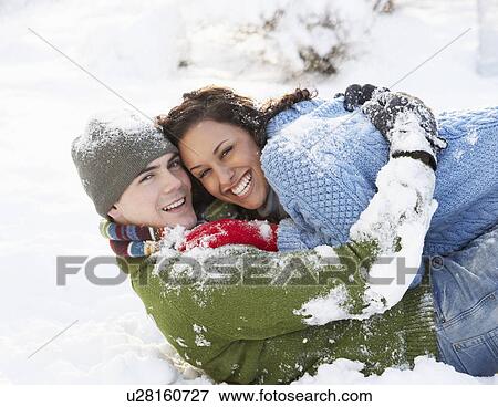 Stock Photo - Romantic Couple Having Fun In Snow. Fotosearch