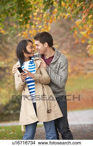 Picture - Romantic Teenage Couple In Autumn Park. Fotosearch