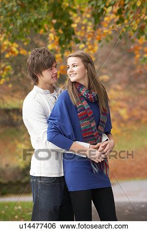 Romantic Teenage Couple In Autumn Park View Large Photo Image Stock Photograph - Romantic Teenage Couple In Autumn Park. Fotosearch