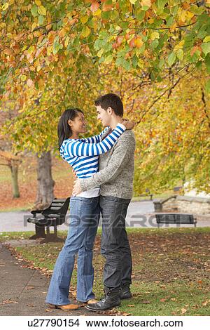Romantic Young Couple In Autumn Park View Large Photo Image Picture - Romantic Young Couple In Autumn Park. Fotosearch