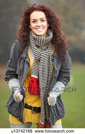 Smiling Teenage Girl Standing In Autumn Landscape View Large Photo Image Stock Photo - Smiling Teenage Girl Standing In Autumn Landscape. Fotosearch