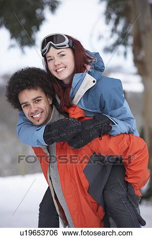 Teenage Boy Giving Girl Piggyback In Snowy Landscape View Large Photo Image Stock Photograph - Teenage Boy Giving Girl Piggyback In Snowy Landscape. Fotosearch