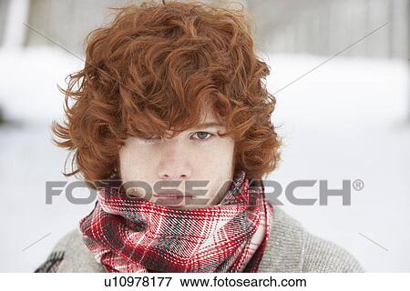 Stock Photo - Teenage Boy Wearing Winter Clothes In Snowy Landscape. Fotosearch