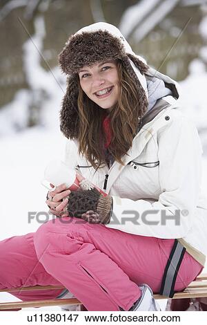 Teenage Girl Sitting On Sledge With Flask And Hot Drink View Large Photo Image Stock Photo - Teenage Girl Sitting On Sledge With Flask And Hot Drink. Fotosearch