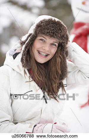 Stock Photo - Teenage Girl Wearing Winter Clothes In Snowy Landscape. Fotosearch
