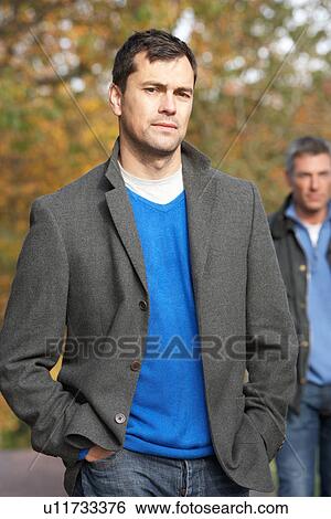 Two Men Standing Outside In Autumn Woodland View Large Photo Image Stock Photograph - Two Men Standing Outside In Autumn Woodland. Fotosearch