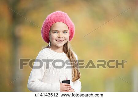 Young Girl Outdoors With MP3 Player View Large Photo Image Stock Image - Young Girl Outdoors With MP3 Player. Fotosearch
