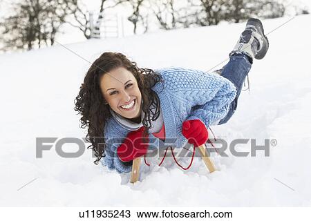 Young Woman Riding On Sledge In Snowy Landscape View Large Photo Image Stock Image - Young Woman Riding On Sledge In Snowy Landscape. Fotosearch