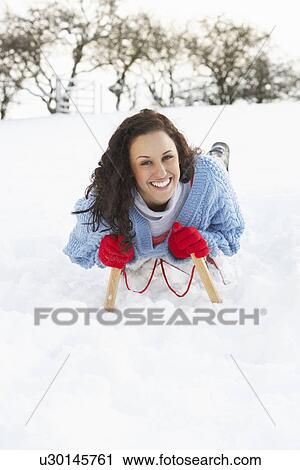 Young Woman Riding On Sledge In Snowy Landscape View Large Photo Image Stock Image - Young Woman Riding On Sledge In Snowy Landscape. Fotosearch