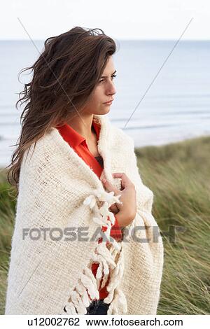 Young Woman Standing In Sand Dunes Wrapped In Blanket View Large Photo Image Stock Image - Young Woman Standing In Sand Dunes Wrapped In Blanket. Fotosearch