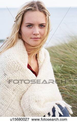 Young Woman Standing In Sand Dunes Wrapped In Blanket View Large Photo Image Stock Photo - Young Woman Standing In Sand Dunes Wrapped In Blanket. Fotosearch