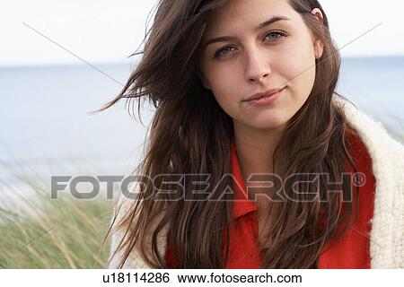 Young Woman Standing In Sand Dunes Wrapped In Blanket View Large Photo Image Stock Photograph - Young Woman Standing In Sand Dunes Wrapped In Blanket. Fotosearch