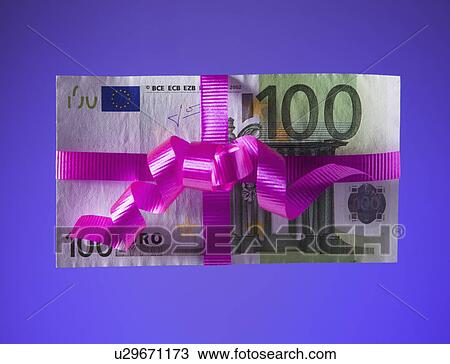 Stock Image - 100 euro bill tied with a pink bow. Fotosearch