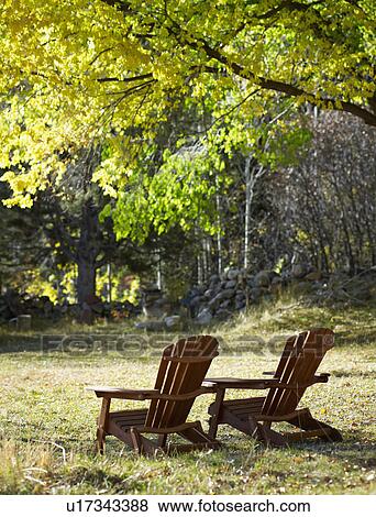 Adirondack chairs on lawn View Large Photo Image Stock Photo - Adirondack chairs on lawn. Fotosearch