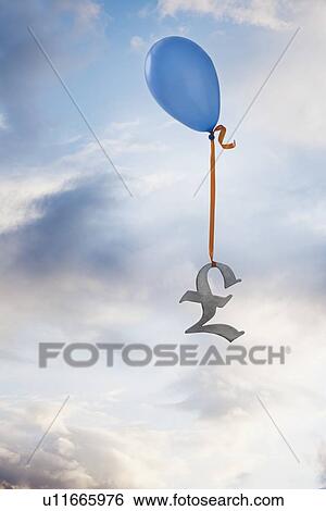 Stock Photograph - Balloon tied to a British pound symbol. Fotosearch