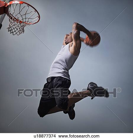Picture - Basketball player jumping. Fotosearch