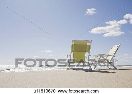 Beach chairs by the ocean View Large Photo Image Stock Image - Beach chairs by the ocean. Fotosearch