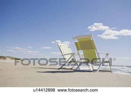 Beach chairs by the ocean View Large Photo Image Stock Photo - Beach chairs by the ocean. Fotosearch