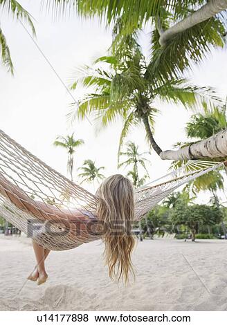 Blonde woman relaxing in hammock View Large Photo Image Stock Photo - Blonde woman relaxing in hammock. Fotosearch
