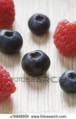Blueberries and raspberries View Large Photo Image Picture - Blueberries and raspberries. Fotosearch
