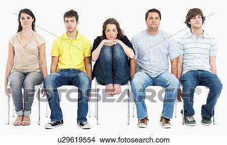 Bored people sitting on chairs View Large Photo Image Picture - Bored people sitting on chairs. Fotosearch