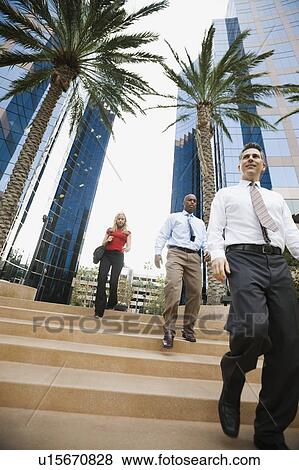 Stock Photo - Business people leaving work. Fotosearch
