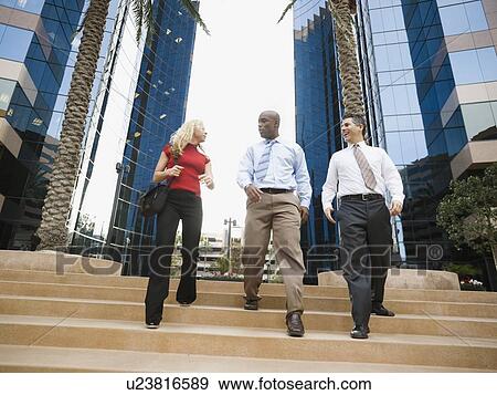 Business people leaving work View Large Photo Image Stock Photo - Business people leaving work. Fotosearch