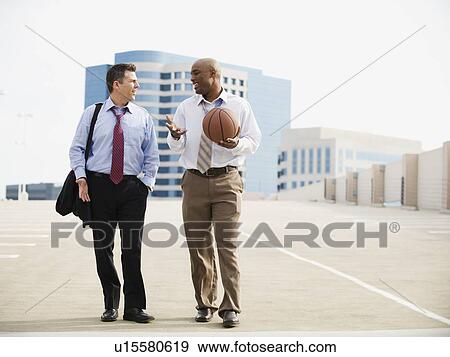 Businessman on their way to basketball game View Large Photo Image Stock Photo - Businessman on their way to basketball game. Fotosearch