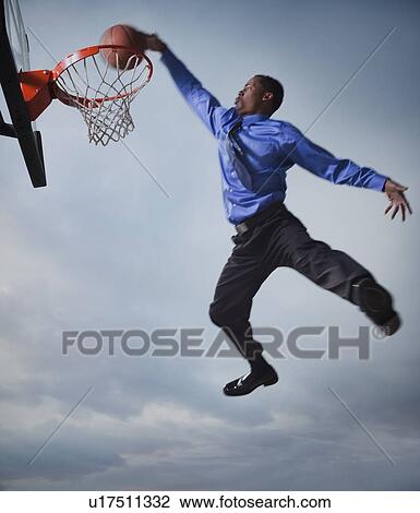 Businessman playing basketball View Large Photo Image Stock Image - Businessman playing basketball. Fotosearch