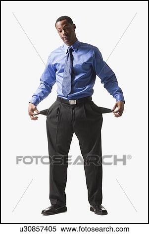 Stock Photography - Businessman pulling out his empty pockets. Fotosearch