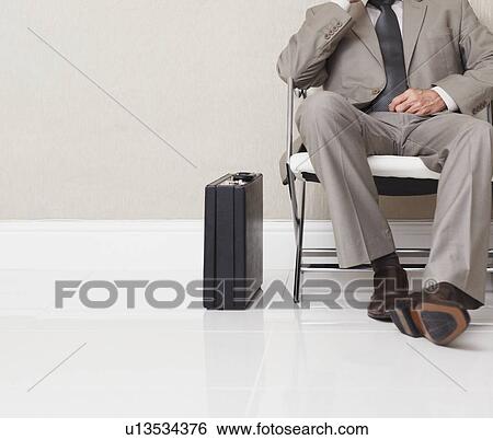 Stock Photograph - Businessman waiting. Fotosearch