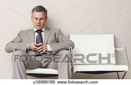 Businessman waiting View Large Photo Image Stock Photograph - Businessman waiting. Fotosearch