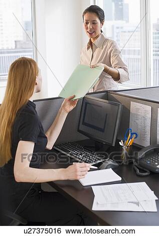 Businesswomen at work View Large Photo Image Stock Photograph - Businesswomen at work. Fotosearch