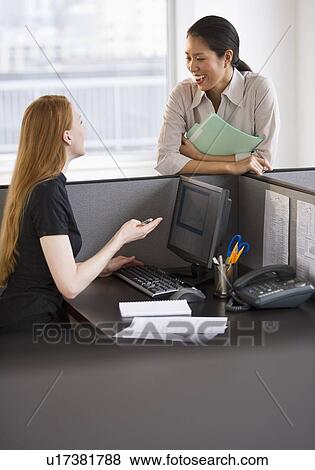 Businesswomen socializing at work View Large Photo Image Stock Photo - Businesswomen socializing at work. Fotosearch