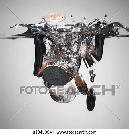 Coins splashing in water View Large Photo Image Stock Image - Coins splashing in water. Fotosearch