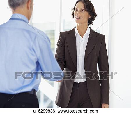 Stock Photograph - Colleagues shaking hands. Fotosearch