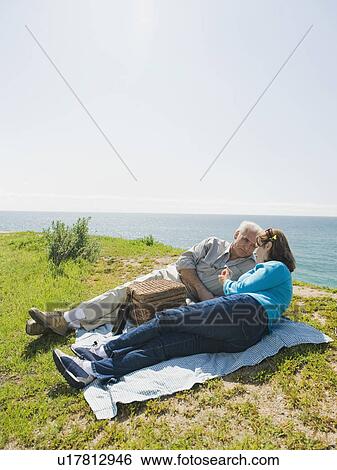 Couple having picnic View Large Photo Image Stock Photograph - Couple having picnic. Fotosearch