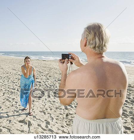 Couple on beach View Large Photo Image Stock Image - Couple on beach. Fotosearch