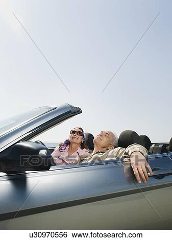 Stock Photograph - Couple on road trip. Fotosearch