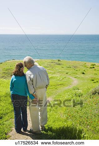 Couple walking to the beach View Large Photo Image Picture - Couple walking to the beach. Fotosearch