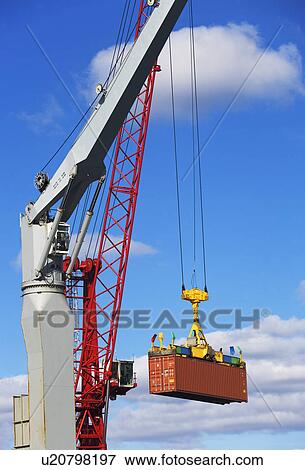 Crane lifting shipping container View Large Photo Image Stock Photo - Crane lifting shipping container. Fotosearch