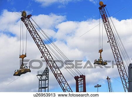 Cranes lifting cargo View Large Photo Image Stock Image - Cranes lifting cargo. Fotosearch