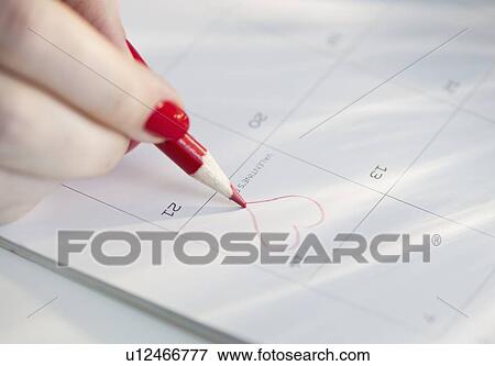 Drawing a heart on a calendar View Large Photo Image Stock Photo - Drawing a heart on a calendar. Fotosearch